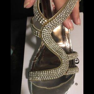 Silver heels covered in rhinestones. Never worn